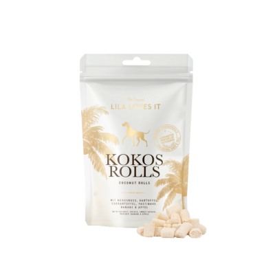 Weiße Verpackung der LILA LOVES IT Kokos Rolls mit goldenen Palmenmotiven. Vor der Packung liegen mehrere helle, kleine Kokos-Röllchen.