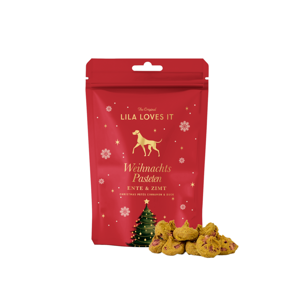 Beutel im weihnachtlichen rot-gold Design, gefüllt mit feinen Ente-Zimt Pasteten für Hunde.