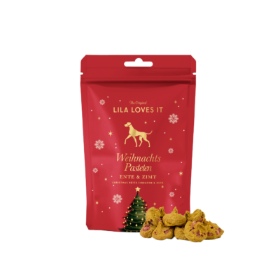 Beutel im weihnachtlichen rot-gold Design, gefüllt mit feinen Ente-Zimt Pasteten für Hunde.